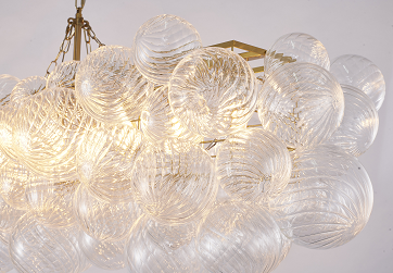 Brass Frame Chandelier featuring Clear Glass Swirl Shades