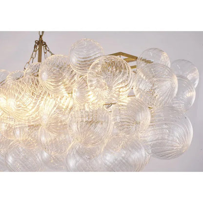 Brass Frame Chandelier featuring Clear Glass Swirl Shades