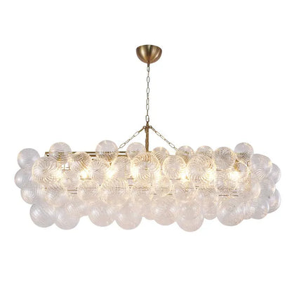 Brass Frame Chandelier featuring Clear Glass Swirl Shades